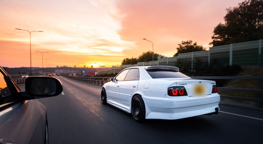 Toyota Chaser on a motorway at sunset, filmed from a chase car