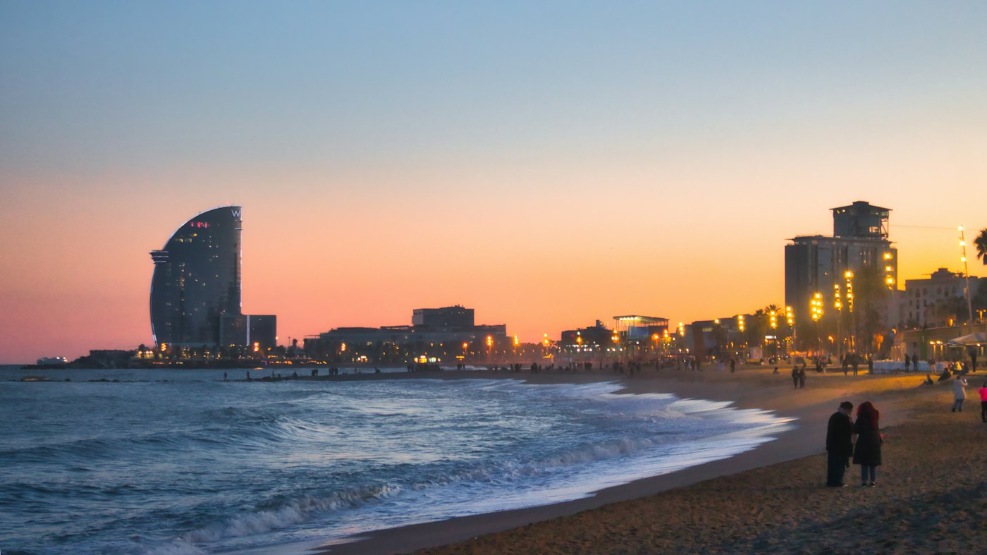 Barcelona beach at sunset, with the W hotel on the seafront