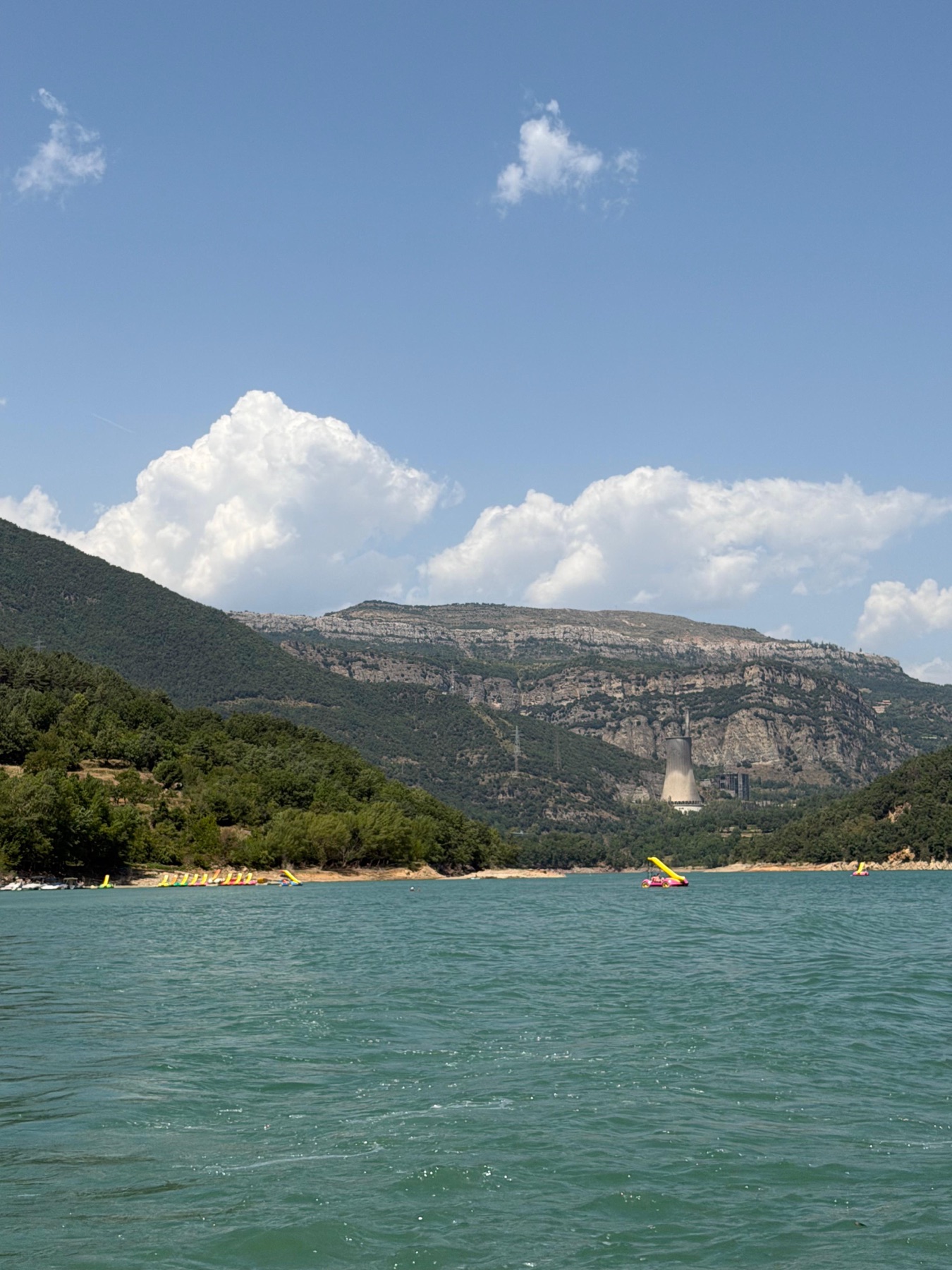 Mountains and clouds over the Baells lake