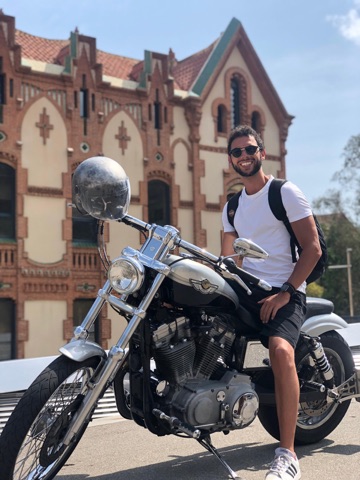 Cruiser parked in front of a modernista brick building in Barcelona