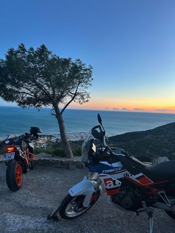 Two motorcycles parked at a sea lookout on the Garraf coast, Catalonia