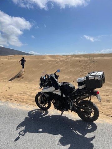 Adventure motorcycle on the sand dunes at Punta Paloma, southern Spain