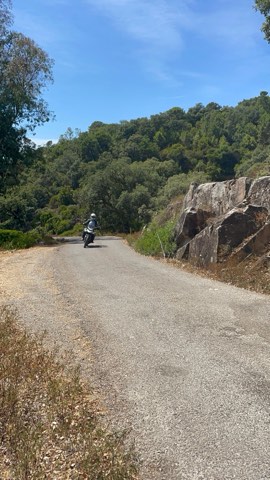 Gravel road between rock outcrops in the Sierra de Grazalema, Andalusia